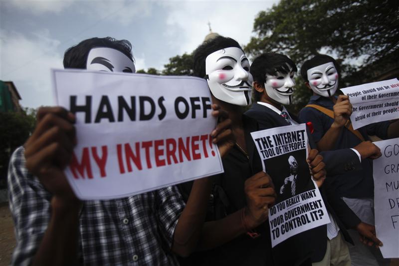 Protesters from the Anonymous India group of hackers wear Guy Fawkes masks as they protest against laws they say gives the government control over censorship of internet usage in Mumbai, June 9, 2012. Anonymous India is associated with the internationa hacker group Anonymous whose previous targets have included high profile targets. REUTERS/Vivek Prakash (INDIA - Tags: SOCIETY SCIENCE TECHNOLOGY POLITICS CIVIL UNREST)