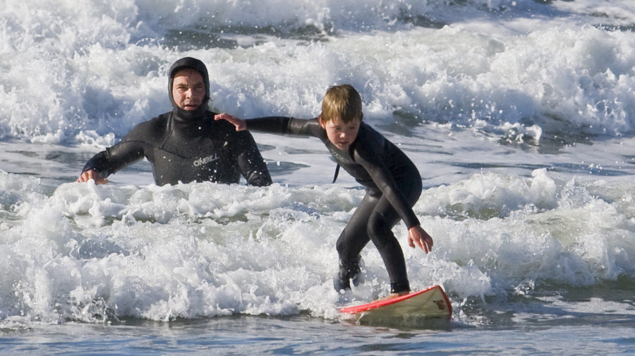 Father and son surf lesson in Morro Bay, CA
