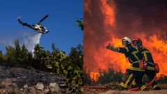 vrtuľník hasiaci požiar a dvojica hasičov prechádzajúca horiacou krajinou