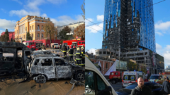 Zničené autá a budova v Kyjeve po ruských útokoch