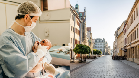 Muž s dieťaťom na rukách a prázdna ulica