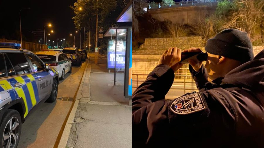 Policajné autá a muž s ďalekohľadom