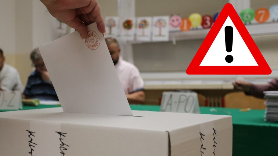 Ruka vhadzuje volebný lístok do urny.