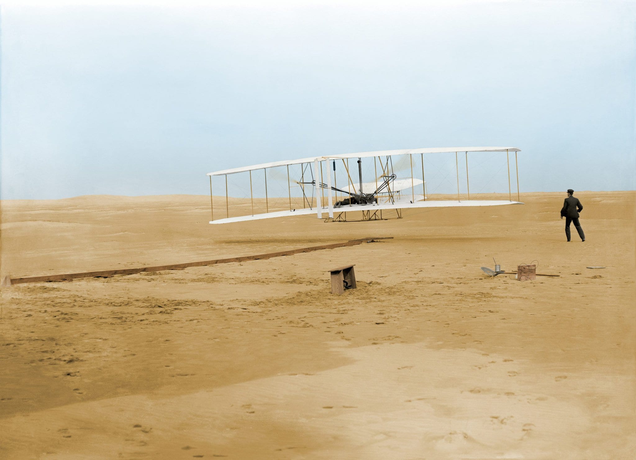 Wright_First_Flight_1903Dec17_(full_restore_115,_colorized)
