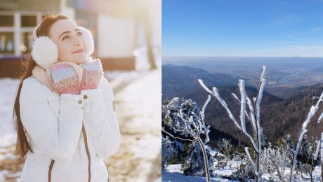 Žena v zime hľadí na oblohu a zamrznuté stromčeky na horách.
